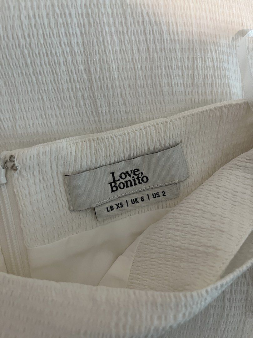 Love Bonito Textured Wrap Skort XS (Category: Skirts) located in Taguig. Submitted by theprettycorner (Listing ID 1444947062, Image 3). Description: - White textured wrap skort - Features a side tie-waist detail - Zipper closure at the back - Size XS.
