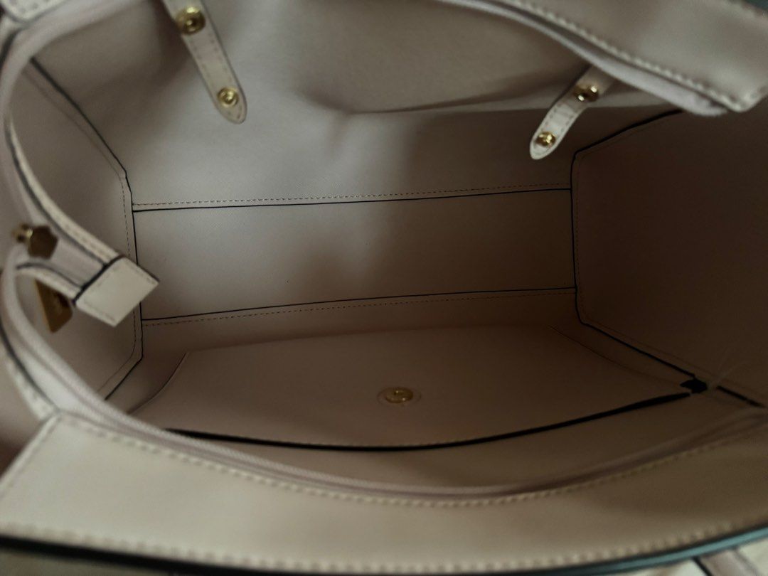 Michael Kors Charlotte 3 in 1 Pink Leather Tote Bag with Matching Wallet and Pouch (Category: Luxury Bags & Wallets) located in Morong. Submitted by lfpvi (Listing ID 1444957745, Image 3). Description: - Authentic Michael Kors pink leather tote bag set - Includes large tote, matching zip-around wallet, and small pouch - Elegant gold hardware details - Spacious interior with pockets in the tote - Ideal for everyday use or travel - tag inside. Dust