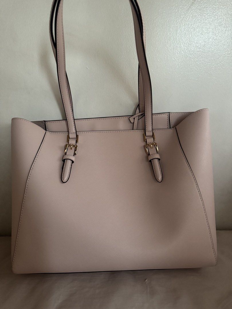 Michael Kors Charlotte 3 in 1 Pink Leather Tote Bag with Matching Wallet and Pouch (Category: Luxury Bags & Wallets) located in Morong. Submitted by lfpvi (Listing ID 1444957745, Image 2). Description: - Authentic Michael Kors pink leather tote bag set - Includes large tote, matching zip-around wallet, and small pouch - Elegant gold hardware details - Spacious interior with pockets in the tote - Ideal for everyday use or travel - tag inside. Dust