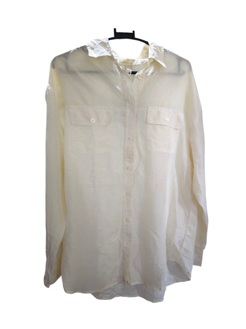 Michael Kors MK Off white Oversized Shirt (Category: Luxury Apparel) located in Munoz. Submitted by harm0nica337 (Listing ID 1444908789, Image 2). Description: - Michael Kors off White oversized shirt - Made with a comfortable linen blend -light weight, slightly see through - Can be styled open or closed for a versatile look - Perfect for achieving a relaxed, chic aesthetic - Easily pairs with shorts or jeans *belt not included MOP: Gcash (Price+