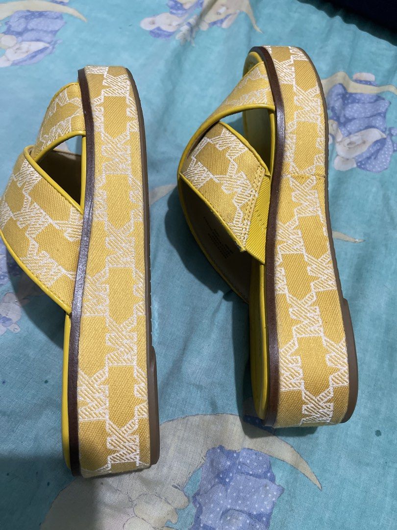 Michael Kors Yellow MK Logo Platform Wedge Sandals (Category: Wedges) located in Manila. Submitted by edensy (Listing ID 1445035736, Image 3). Description: - Yellow Michael Kors platform sandals - Features iconic MK logo pattern on straps - Comfortable wedge heel for added height - Easy slip-on design mild flaws hardly notice - Ideal for casual outings and everyday wear.