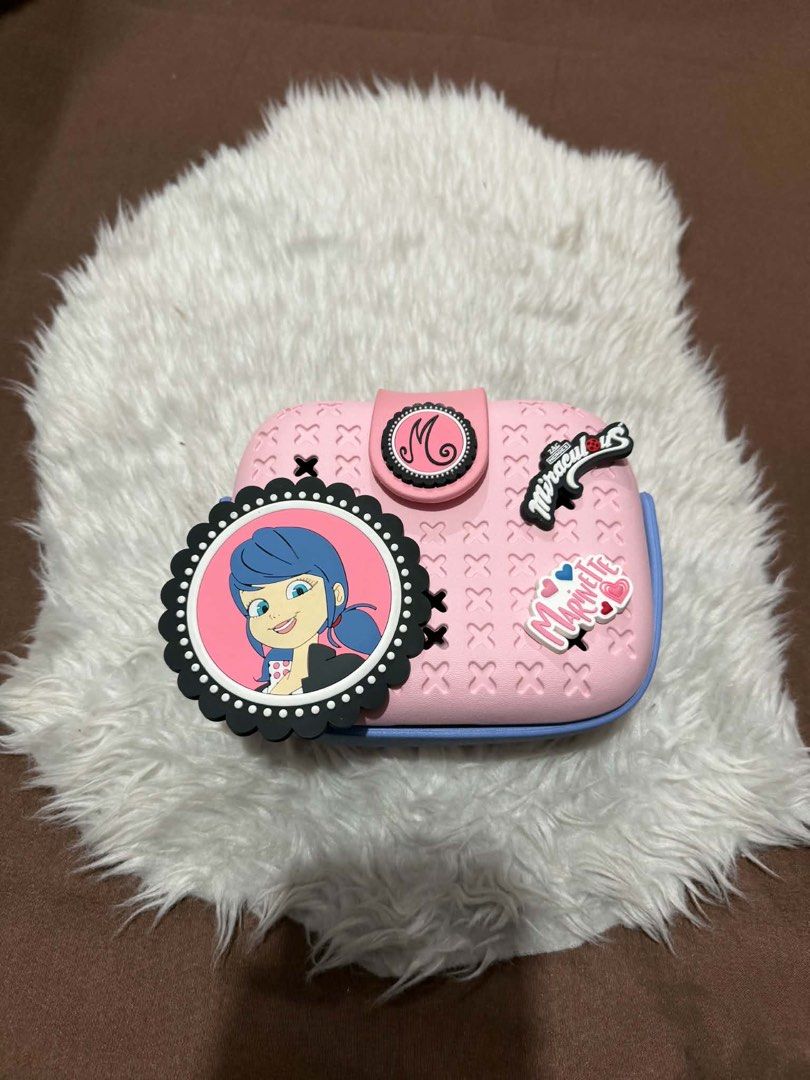 Miraculous Pop N' Swop Marinette Bag (Category: Cases & Sleeves) located in Manila. Submitted by motscollections041421 (Listing ID 1444870921, Image 1). Description: This product is the Miraculous Pop N’ Swop Marinette Pink Purse, an officially licensed accessory from the Miraculous: Tales of Ladybug and Cat Noir series..