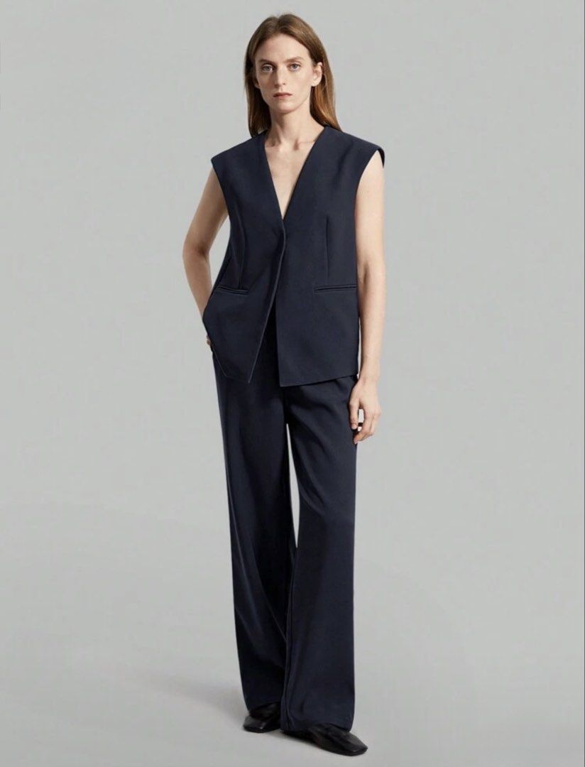 Navy Blue Sleeveless Pants Suit (Category: Sets or Coordinates) located in Quezon City. Submitted by pgv18 (Listing ID 1445033241, Image 1). Description: - Like new - Thick material with lining - Sleeveless V-neck vest with pockets - Wide-leg trousers - Perfect for work or casual events.