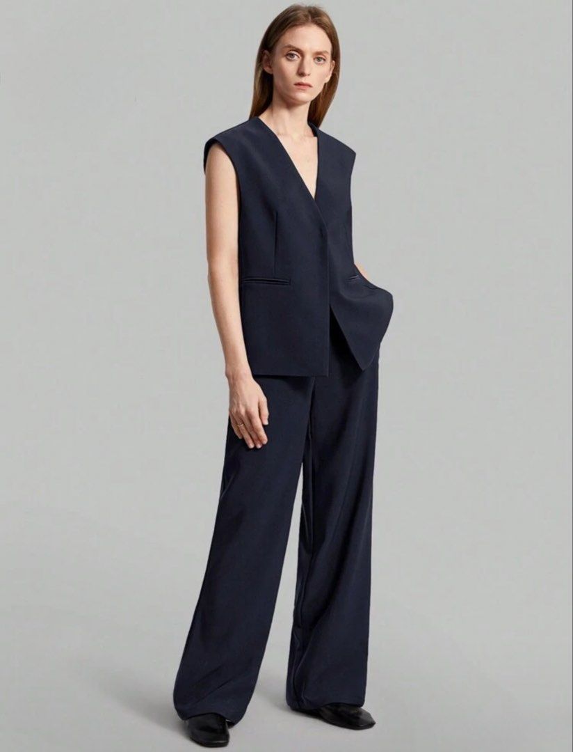Navy Blue Sleeveless Pants Suit (Category: Sets or Coordinates) located in Quezon City. Submitted by pgv18 (Listing ID 1445033241, Image 3). Description: - Like new - Thick material with lining - Sleeveless V-neck vest with pockets - Wide-leg trousers - Perfect for work or casual events.