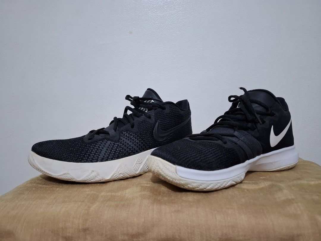 Nike Kyrie Flytrap II Black White Basketball Shoes (Category: Sneakers) located in Muntinlupa City. Submitted by iaramos (Listing ID 1444981272, Image 2). Description: - Black Nike Kyrie basketball shoes - White sole with yellow and black tread - Black laces - Suitable for basketball or casual wear - Minor scuffs on white soles.