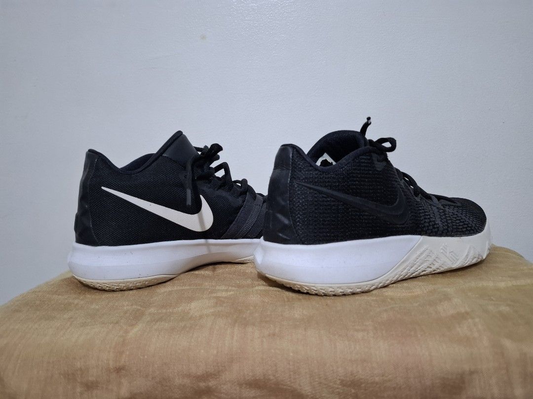Nike Kyrie Flytrap II Black White Basketball Shoes (Category: Sneakers) located in Muntinlupa City. Submitted by iaramos (Listing ID 1444981272, Image 1). Description: - Black Nike Kyrie basketball shoes - White sole with yellow and black tread - Black laces - Suitable for basketball or casual wear - Minor scuffs on white soles.