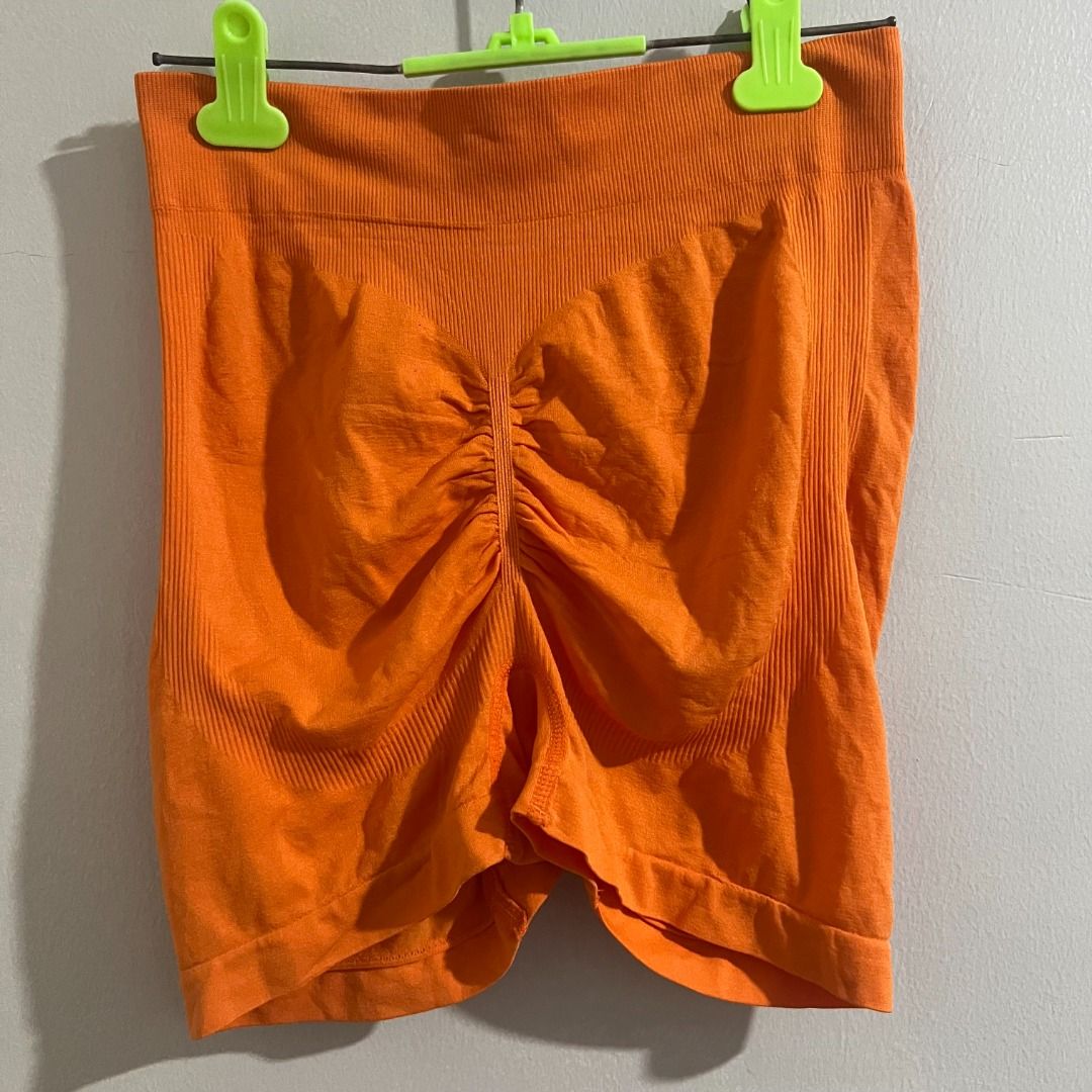 Orange Seamless Ruched Butt Lift Shorts (Category: Shorts) located in Pasay City. Submitted by leagn_07 (Listing ID 1445016409, Image 2). Description: - Super comfy seamless shorts - Bright orange color - High-waisted design - Ruched detail at the back to enhance shape - Stretchy material for a great fit - Ideal for workouts or lounging.