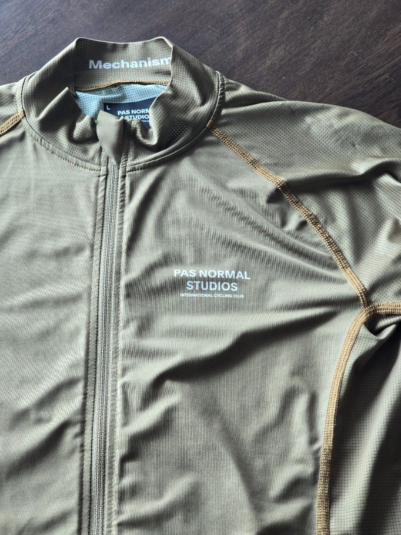 Pas Normal Studios Mechanism Cycling Jersey - Khaki (Category: Activewear) located in Quezon City. Submitted by mr.stealdeal (Listing ID 1445014881, Image 2). Description: - Pas Normal Studios Khaki Cycling Jersey - Mechanism Line - Full zip front - Three back pockets - Ribbed cuffs and hem - Ideal for cycling.