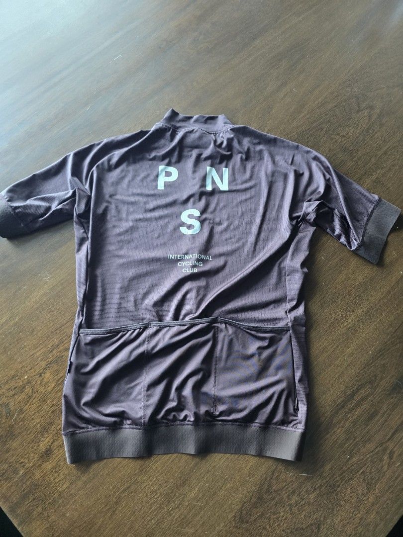 Pas Normal Studios Mechanism Long Sleeve Cycling Jersey (Category: Activewear) located in Quezon City. Submitted by mr.stealdeal (Listing ID 1445015219, Image 3). Description: - Brand: Pas Normal Studios - Model: Mechanism Long Sleeve Cycling Jersey - Color: Dark Purple/Brown - Features: Full zip front, 3 rear pockets - Branding: "Mechanism" text on sleeve, "Pas Normal Studios International Cycling Club" on front - Ideal for: Cycling.