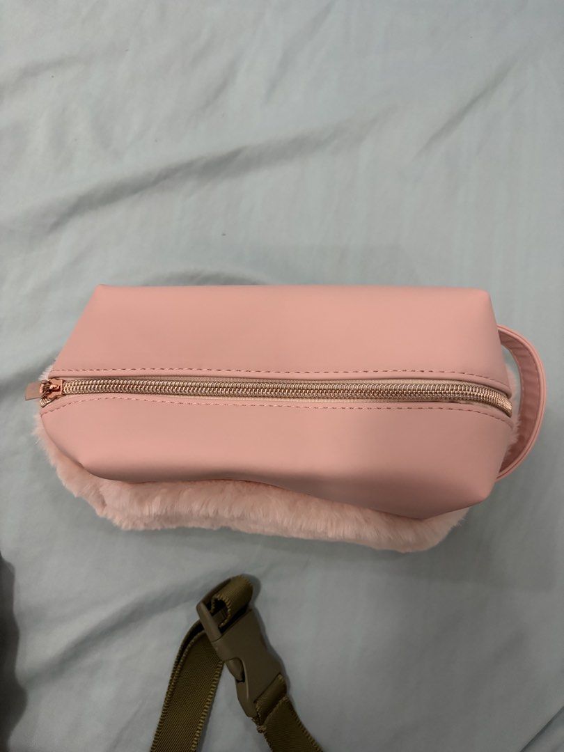 Pink Faux Fur Makeup Bag (Category: Purses & Pouches) located in Cavite. Submitted by mbsj23 (Listing ID 1444973781, Image 2). Description: - Adorable pink cosmetic bag - Features fluffy faux fur trim - Stylish rose gold zipper closure - Spacious interior for all your essentials - Includes a clear zippered pocket for organization - Ideal for makeup and toiletries - Perfect size for travel or everyday use.