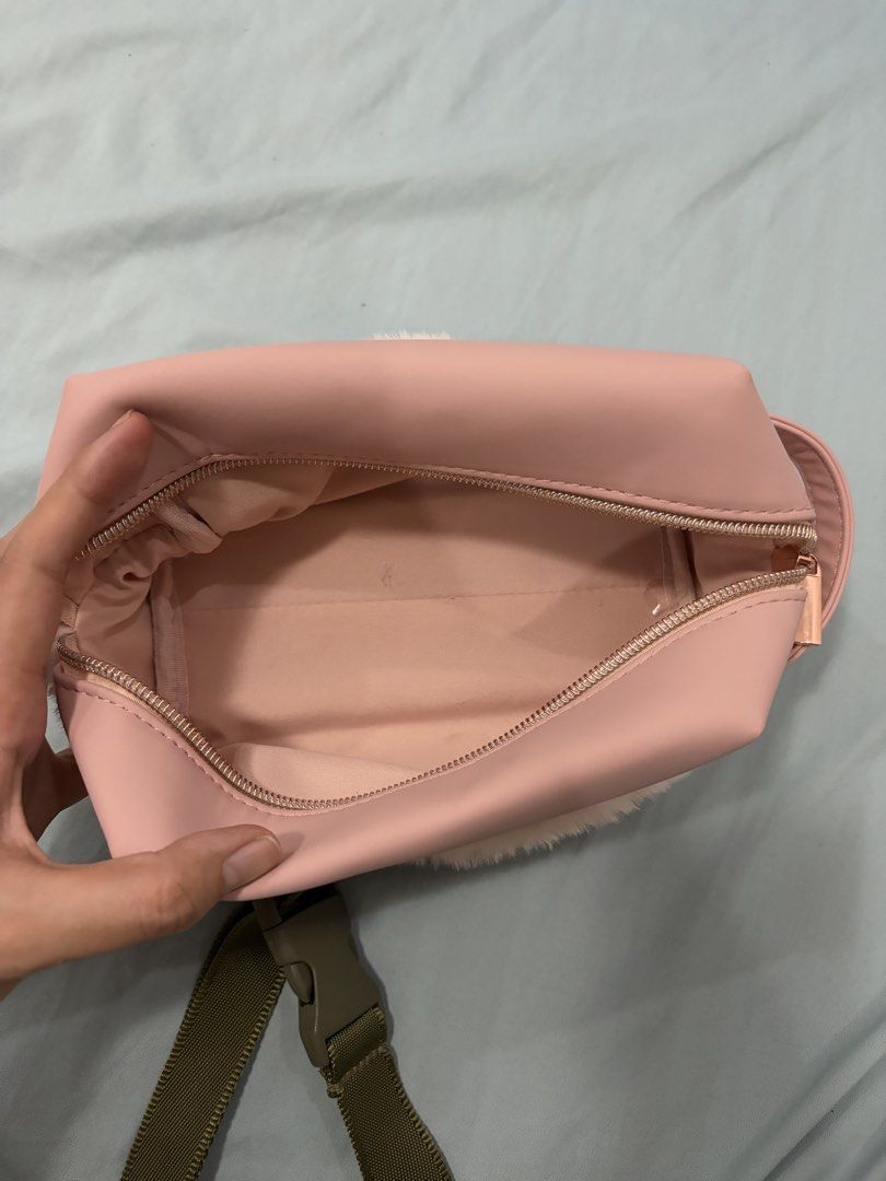 Pink Faux Fur Makeup Bag (Category: Purses & Pouches) located in Cavite. Submitted by mbsj23 (Listing ID 1444973781, Image 3). Description: - Adorable pink cosmetic bag - Features fluffy faux fur trim - Stylish rose gold zipper closure - Spacious interior for all your essentials - Includes a clear zippered pocket for organization - Ideal for makeup and toiletries - Perfect size for travel or everyday use.