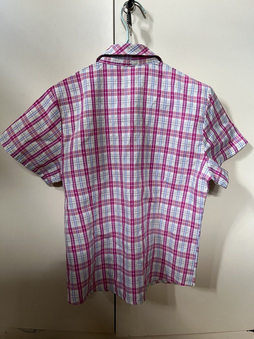 PINK Plaid Short Sleeve Button-Up Shirt (Category: Blouses) located in Nabua. Submitted by twelvet (Listing ID 1444882727, Image 2). Description: - Classic plaid short-sleeve shirt - Features a pink, white, and blue pattern - Two chest pockets - Button-up front - Ideal for casual wear - SMALL TO MEDIUM.