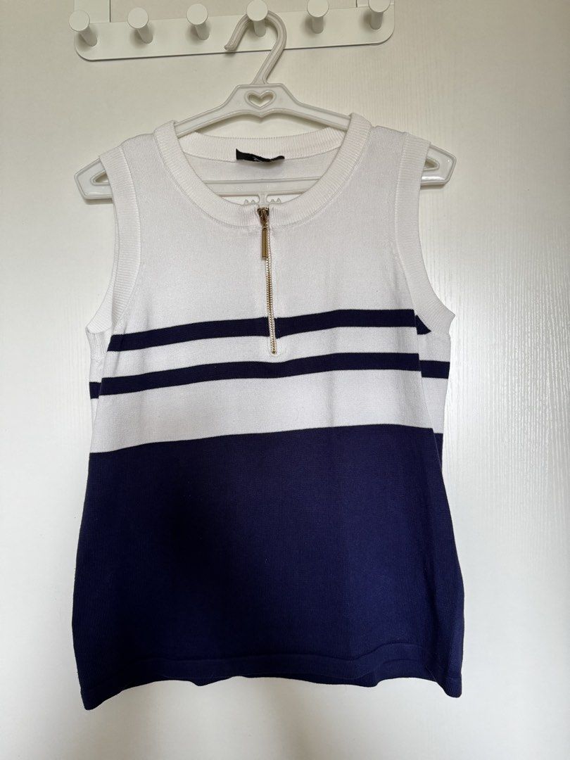 Plains & Prints Sleeveless Zip Top - White Navy Stripes (Category: Sleeveless) located in Muntinlupa City. Submitted by gclosetcleanup (Listing ID 1445005282, Image 1). Description: - Sleeveless knit top from Plains & Prints - Two-tone design: White with navy stripes (top), solid navy (bottom) - Gold zipper detail at the neckline - Versatile: Great for layering or wearing alone - Comfortable knit material.