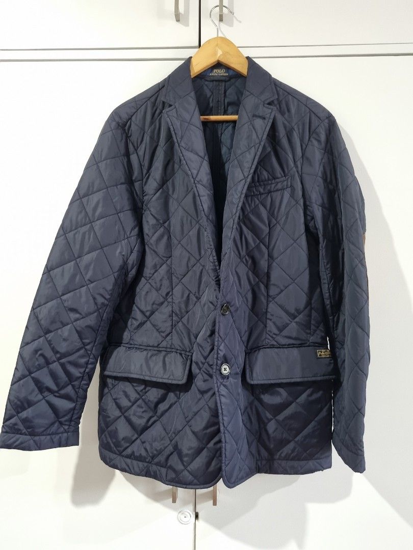 Polo Ralph Lauren Quilted Jacket Navy M/M (Category: Coats, Jackets and Outerwear) located in Makati City. Submitted by amveee (Listing ID 1445041720, Image 1). Description: - Navy blue quilted jacket - Brand: Polo Ralph Lauren - Size: M/M - Features suede elbow patches - Button closure - Front pockets - Made in China - Ideal for layering.