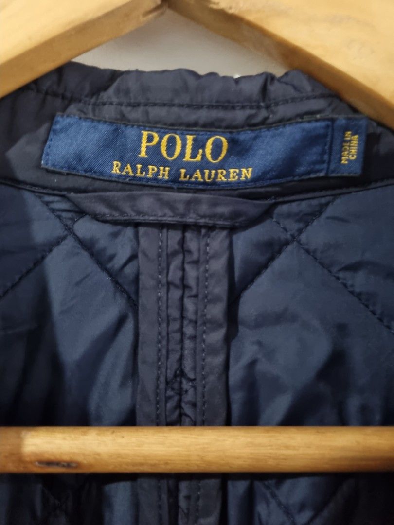 Polo Ralph Lauren Quilted Jacket Navy M/M (Category: Coats, Jackets and Outerwear) located in Makati City. Submitted by amveee (Listing ID 1445041720, Image 3). Description: - Navy blue quilted jacket - Brand: Polo Ralph Lauren - Size: M/M - Features suede elbow patches - Button closure - Front pockets - Made in China - Ideal for layering.