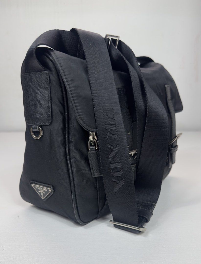 Prada Black Nylon Messenger Bag (Category: Luxury Bags & Wallets) located in Manila. Submitted by collect__ph (Listing ID 1444905963, Image 1). Description: - Black nylon with leather accents - Adjustable shoulder strap with Prada branding - Multiple zip compartments for storage - Silver hardware details - Ideal for everyday use.