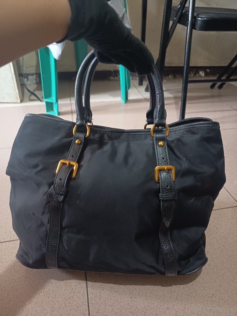 PRADA NYLON TOTE BAG (Category: Luxury Bags & Wallets) located in Bulacan. Submitted by wendyluxury (Listing ID 1441889166, Image 3). Description: Prada nylon tote bag black color lampo zip with white tag good condition negotiable.