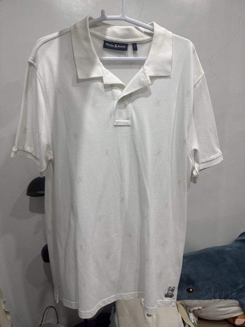 Psycho Bunny White Polo Shirt (Category: Tshirts & Polo Shirts ) located in Cainta. Submitted by starrrrr08 (Listing ID 1444982557, Image 1). Description: NEGOTIABLE - White Psycho Bunny polo shirt - Features signature bunny logo print all over - Short sleeves - Classic collar - Versatile for casual or smart-casual styling - Easy to pair with various outfits.