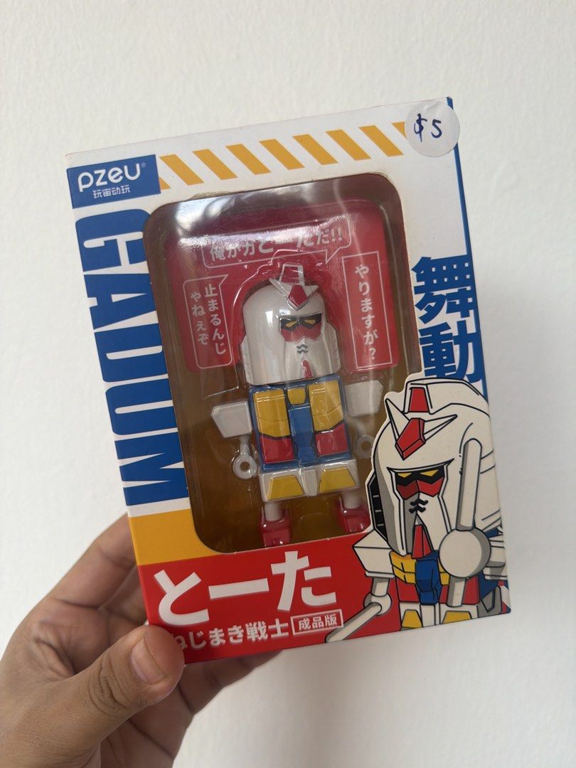 Pzeu Gundam "Tou-ta" Mech Warrior Figure (Category: Gundam Model Kits) located in Singapore. Submitted by kazkirin09 (Listing ID 1444880650, Image 1). Description: - Pzeu "Tou-ta" Mech Warrior figure - "Seijinban" edition - Features classic Gundam-inspired design - Box includes Japanese text and graphics - Perfect for collectors - Price: $5.