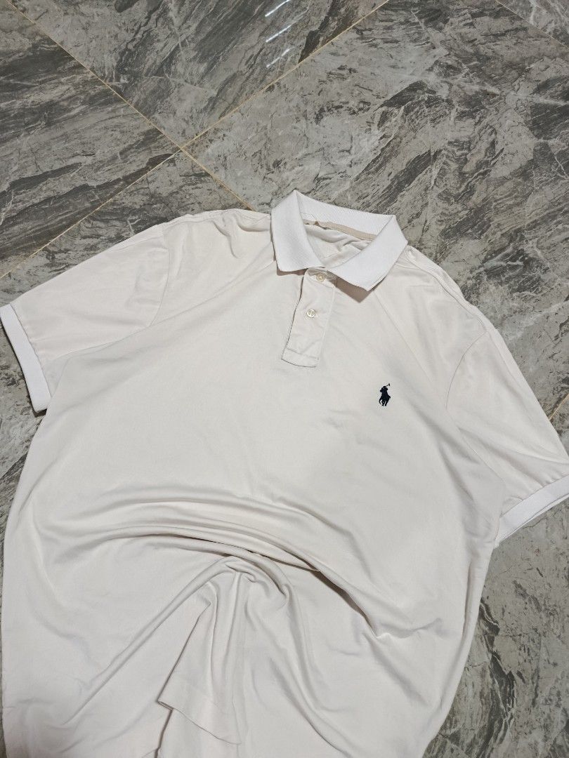 Ralph Lauren Performance Polo Shirt (Category: Tshirts & Polo Shirts ) located in Prosperidad. Submitted by basicdept07 (Listing ID 1444938621, Image 2). Description: Ralph Lauren Performance Polo Shirt Mine:🏷️349+sf Dimes: 21 width/ 28.5-31 length Complete tags Color rate and condition: 9.5/10 Loose stitch and minimal stain Kindly dm if interested 📥.