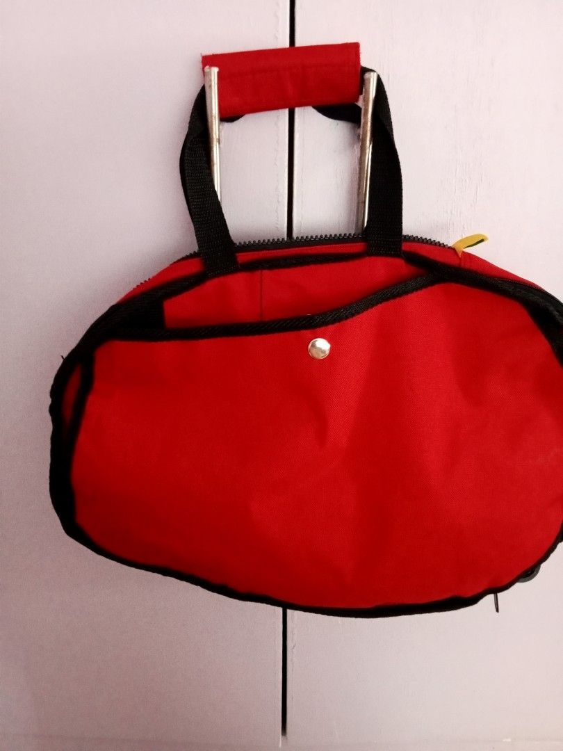 Red Winnie the Pooh Tote Bag (Category: Tote Bags) located in Santa Rosa. Submitted by vverb09 (Listing ID 1444914276, Image 2). Description: - Adorable red tote bag featuring Winnie the Pooh - Charming design with butterflies, bees, and flowers - Stylish black trim and handles - Secure zipper closure - Ideal for carrying your daily essentials.