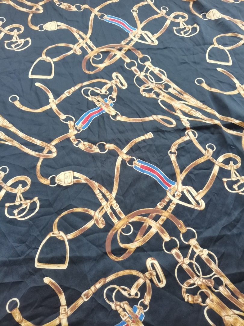 vintage equestrian belt and chain pattern SCARF (Category: Scarves) located in Santa Cruz. Submitted by oddpenguin-4575 (Listing ID 1444988311, Image 3). Description: 📌.....P L E A S E R E A D..... 📌measurement:L-28"/W-27" 📌color-10/10 📌Brand:no brand 📌issue:❌ 📌-black square scarf features a vintage equestrian belt and chain pattern with a contrasting red border. 📌Actual shades may differ slightly depending on ambient lighting conditions. 