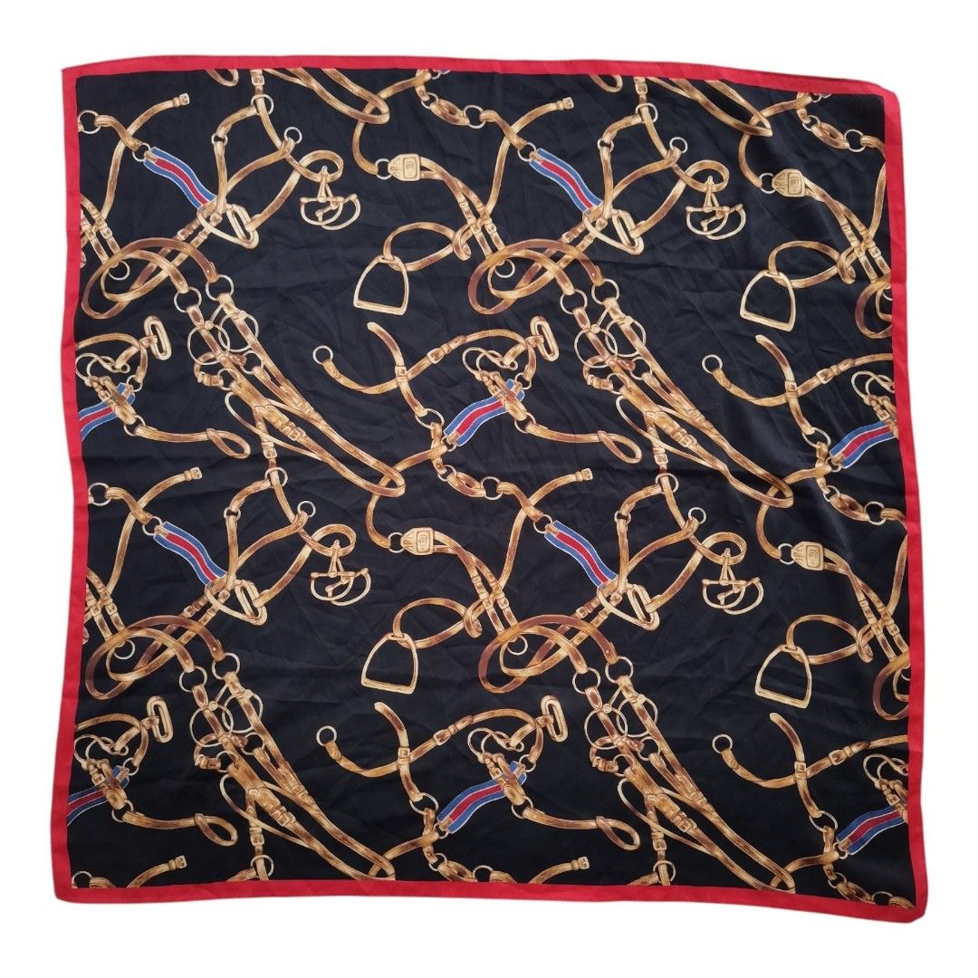 vintage equestrian belt and chain pattern SCARF (Category: Scarves) located in Santa Cruz. Submitted by oddpenguin-4575 (Listing ID 1444988311, Image 1). Description: 📌.....P L E A S E R E A D..... 📌measurement:L-28"/W-27" 📌color-10/10 📌Brand:no brand 📌issue:❌ 📌-black square scarf features a vintage equestrian belt and chain pattern with a contrasting red border. 📌Actual shades may differ slightly depending on ambient lighting conditions. 