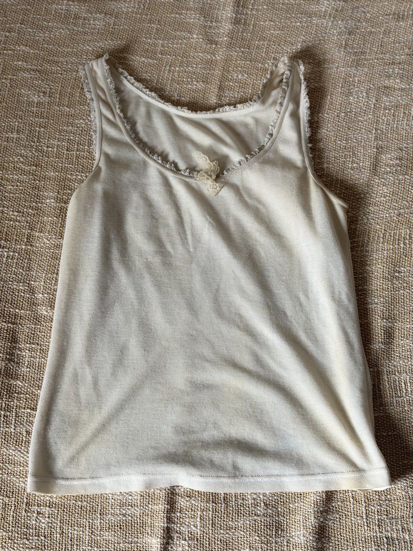 Ribbon dainty tank top white (Category: Shirts) located in Pasig City. Submitted by ctiner (Listing ID 1444943836, Image 1). Description: Has staains but can be removed if washed S-M.