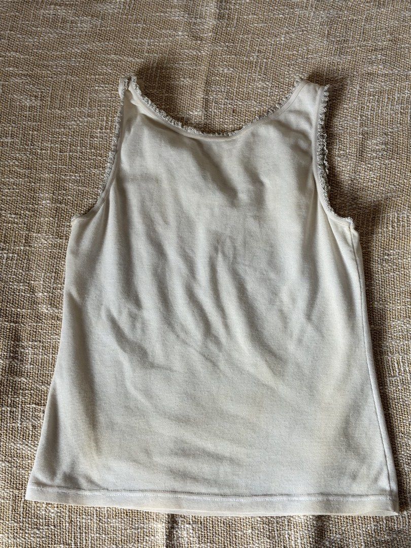 Ribbon dainty tank top white (Category: Shirts) located in Pasig City. Submitted by ctiner (Listing ID 1444943836, Image 2). Description: Has staains but can be removed if washed S-M.