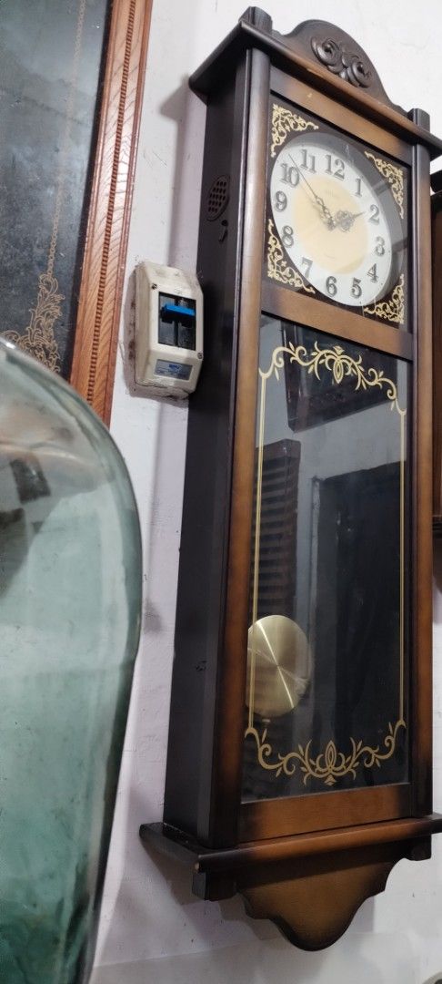 Seiko Quartz Pendulum Wall Clock (Category: Clocks) located in Caloocan City. Submitted by rowely_jpn (Listing ID 1444991778, Image 3). Description: Selling a Seiko Quartz pendulum wall clock. Wood casing with decorative gold accents. The pendulum swings to keep time. Great for living room or hallway. Measures approximately [height] x [width] x [depth]. Battery operated ,working ..
