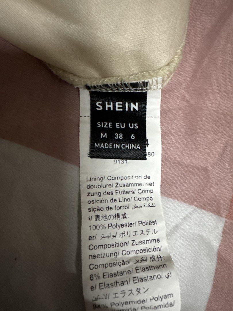 SHEIN Ruched Strapless Bodycon Mini Dress (Category: Dresses) located in Manila. Submitted by lucilabis41619 (Listing ID 1444922364, Image 2). Description: - SHEIN Strapless Mini Dress - Color: Cream/Beige - Features: Ruched detailing all over, bodycon silhouette - Fit: Flattering and figure-hugging - Size: Medium (US 6) - Material: 100% Polyester lining, 94% Polyamide/6% Elastane outer - Occasion: Ideal for night outs or parties.