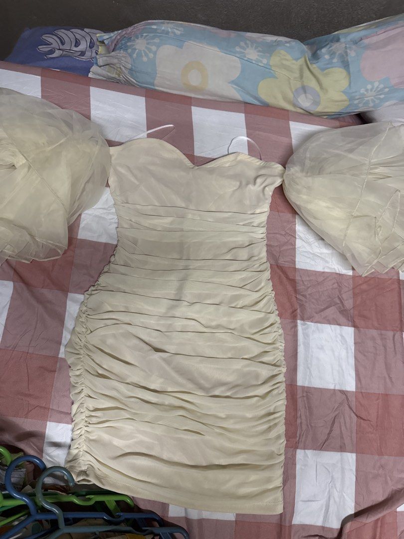 SHEIN Ruched Strapless Bodycon Mini Dress (Category: Dresses) located in Manila. Submitted by lucilabis41619 (Listing ID 1444922364, Image 1). Description: - SHEIN Strapless Mini Dress - Color: Cream/Beige - Features: Ruched detailing all over, bodycon silhouette - Fit: Flattering and figure-hugging - Size: Medium (US 6) - Material: 100% Polyester lining, 94% Polyamide/6% Elastane outer - Occasion: Ideal for night outs or parties.