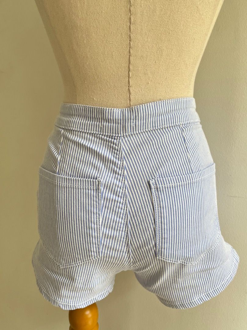 Sinsay Blue & White Striped High Waist Shorts Size 34 (Category: Shorts) located in Muntinlupa City. Submitted by boo_thingthings (Listing ID 1444924607, Image 3). Description: • Sinsay striped shorts • Size 34 • Blue and white vertical stripe pattern • High-waist fit • Lightweight cotton blend feel • Side pockets • Casual, summer, beach, vacation, and everyday wear • Easy to pair with tanks, crop tops, blouses, and sandals • Pre-loved and in goo