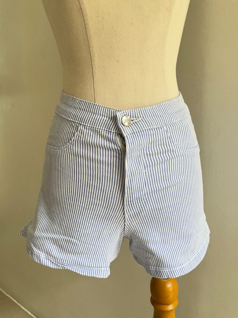 Sinsay Blue & White Striped High Waist Shorts Size 34 (Category: Shorts) located in Muntinlupa City. Submitted by boo_thingthings (Listing ID 1444924607, Image 2). Description: • Sinsay striped shorts • Size 34 • Blue and white vertical stripe pattern • High-waist fit • Lightweight cotton blend feel • Side pockets • Casual, summer, beach, vacation, and everyday wear • Easy to pair with tanks, crop tops, blouses, and sandals • Pre-loved and in goo