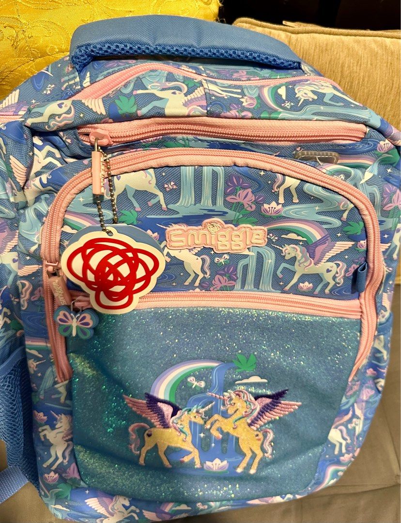 Smiggle Far Away Backpack with Four Zipped Compartments Unicorn Print (Category: Backpacks) located in Manila. Submitted by preloved_by_ea (Listing ID 1444876210, Image 3). Description: Girls bag - bago hindi nagamit - nakastock na lang Details: Four Zipped Compartments - Main Compartment With Double Zip Dual Drink Bottle Sleeves Padded Adjustable Shoulder Straps & Padded Carry Handle 15-Inch Laptop Compartment & Lined Media Device Pocket With He