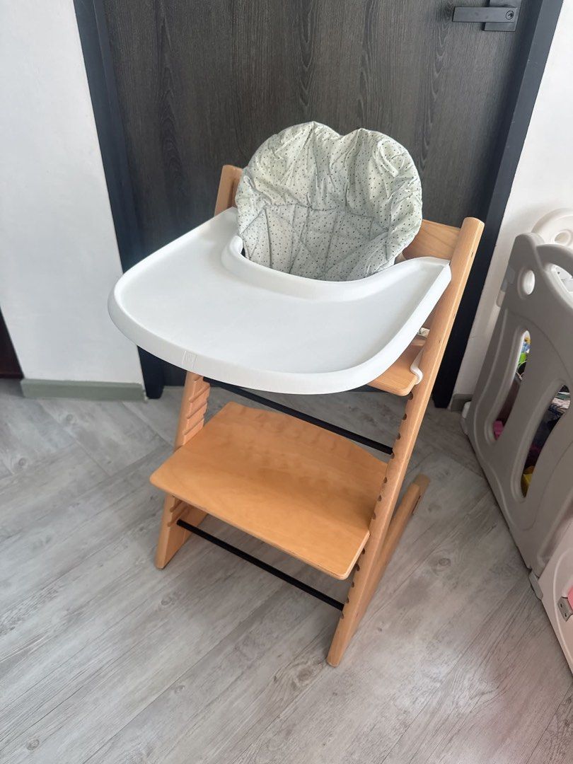 Stokke Tripp Trapp High Chair for Baby in Natural (Category: Baby High Chairs) located in Singapore. Submitted by hibyejames (Listing ID 1444893493, Image 2). Description: Price is firm. All authentic. Includes tray, harness, baby set and gliders. Will throw in the cushion for free! Self collect from tampines or add $25 for courier delivery..