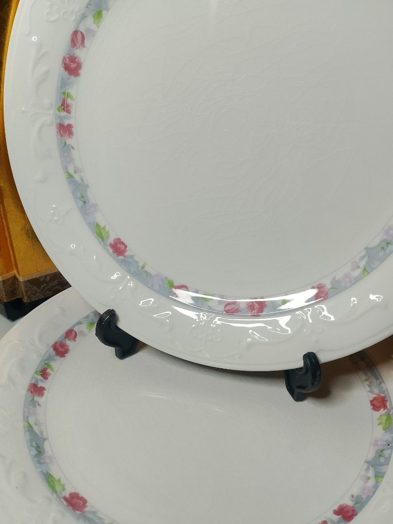 Super China Dinner Plates Set of 2 Floral Pattern (Category: Dinnerware & Cutlery) located in Valenzuela. Submitted by buylaaaaa (Listing ID 1444934773, Image 2). Description: - Set of 2 Super China dinner plates - Diameter: Approximately 8.5 inches - Color: White with delicate pink and blue floral border - Features embossed detailing on the rim - Note: Some visible crazing on the surface - Ideal for everyday dining or decorative display.