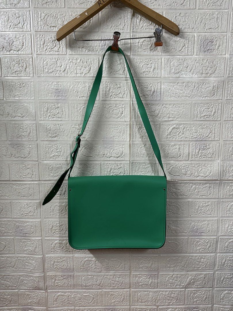 The Cambridge Satchel Company Green Leather Satchel Bag (Category: Luxury Bags & Wallets) located in Bacoor. Submitted by reneejhay (Listing ID 1444983361, Image 2). Description: - Genuine green leather satchel bag - Brand: The Cambridge Satchel Company - Classic design with secure buckle closures - Adjustable shoulder strap for comfort - Ample interior space for essentials - Perfect for everyday use or as a stylish statement piece - A timeless a
