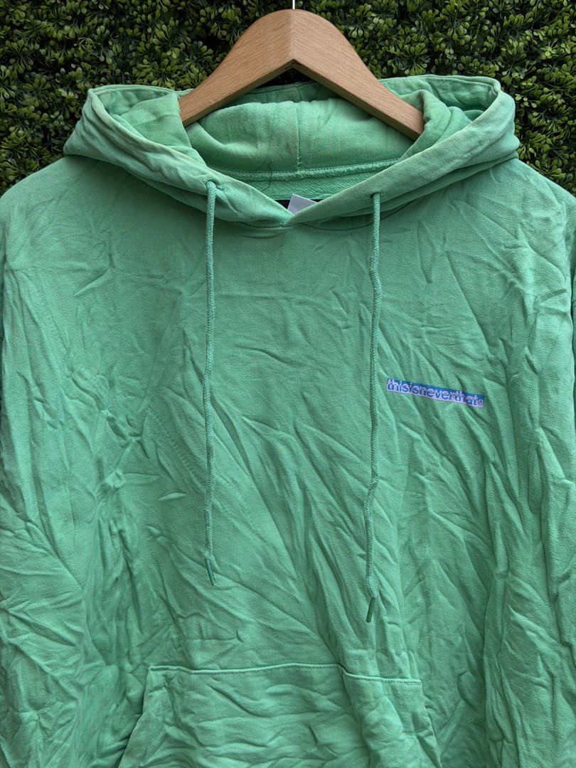 thisisneverthat Green Hoodie with Sleeve Logo (Category: Hoodies) located in Bacolod City. Submitted by Ms_OnlineBoutiqe (Listing ID 1444945652, Image 2). Description: - Authentic thisisneverthat green hoodie -width 24 -length 27 - Bold blue brand name printed on chest - Repeating blue logo down both sleeves - Comfortable pullover style - Convenient front pocket.