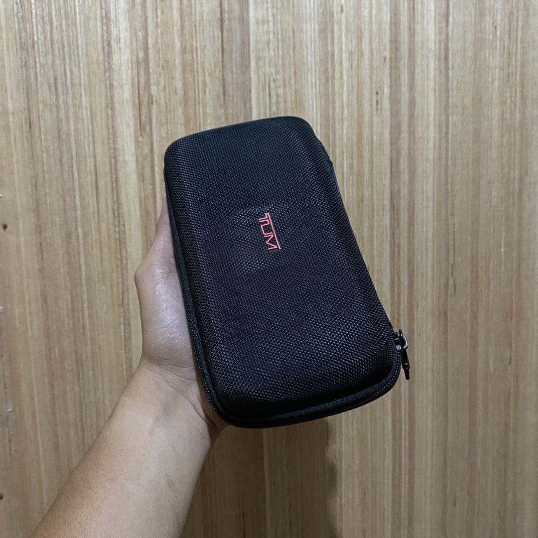Tumi for Delta Travel Case Pouch (Category: Luxury Bags & Wallets) located in Dipolog. Submitted by thriftcher (Listing ID 1445018333, Image 2). Description: - Genuine Black Tumi travel case - Features 'for Delta' branding inside - Secure zipper closure - Durable hard shell exterior for protection - Ideal for organizing small travel items - Compact and easy to pack Dm..