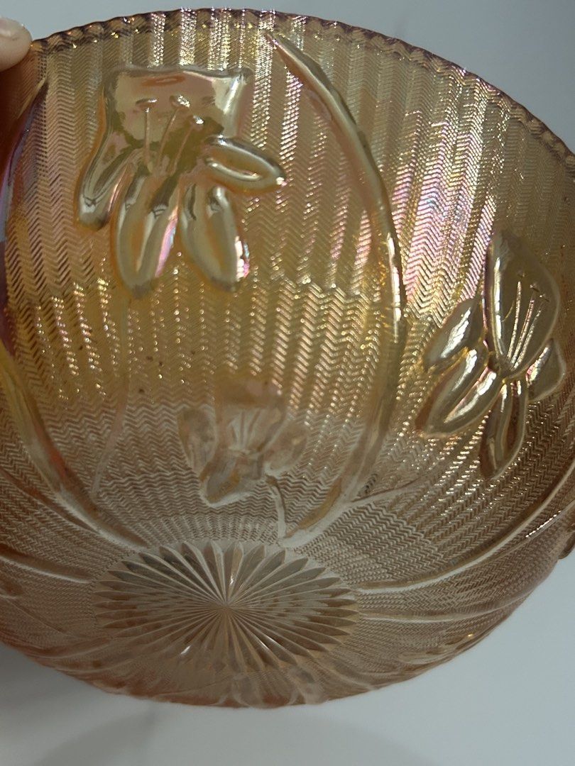 Vintage Jeannette Iris Iridescent (Category: Dinnerware & Cutlery) located in Caloocan City. Submitted by ksshboutique (Listing ID 1444873273, Image 3). Description: This is a vintage Jeannette Iris & Herringbone iridescent marigold carnival glass bowl, featuring a beaded edge and a floral design. Size 8” .