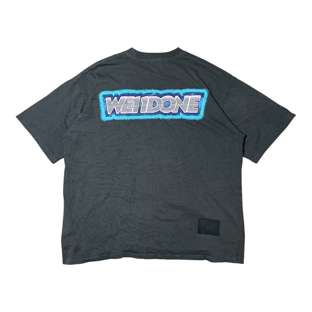 WE11DONE Oversized Graphic T-Shirt (Category: Tshirts & Polo Shirts ) located in Naga. Submitted by eunhasowon12391 (Listing ID 1444900019, Image 1). Description: - Grey WE11DONE oversized t-shirt - Size: L - Material: 100% Cotton - Features: Bold graphic print on back, small embroidered logo on front chest - Style: Relaxed, streetwear - Condition: Please check photos for details.