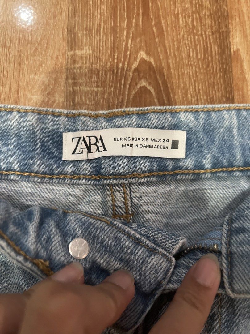 Zara Light Wash Distressed Denim Mini Skirt (Category: Skirts) located in Tarlac. Submitted by leyna_aa (Listing ID 1445012973, Image 2). Description: - Zara light wash denim mini skirt - Distressed details and raw hem - Classic 5-pocket styling - Button and zip closure - Made in Bangladesh - Ideal for casual outfits.