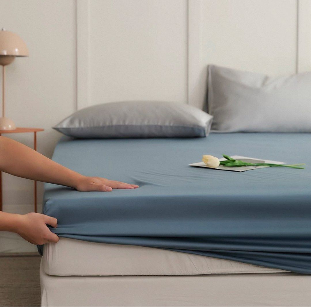 1.5M Tencel Fitted Bed Sheets with Elastic Edges and Pillowcases - Multiple Colors (Category: Bedding & Towels) located in Singapore. Submitted by swifthorse.ace74d (Listing ID 1445169885, Image 1). Description: - Fitted bed sheets with elastic for easy fitting. - Available in muted colors: dusty rose, dusty blue, dark grey. - Made from a smooth, soft fabric. - Enhances bedroom comfort and style. One fitted sheet S$35. Two pillowcases S$20. One f