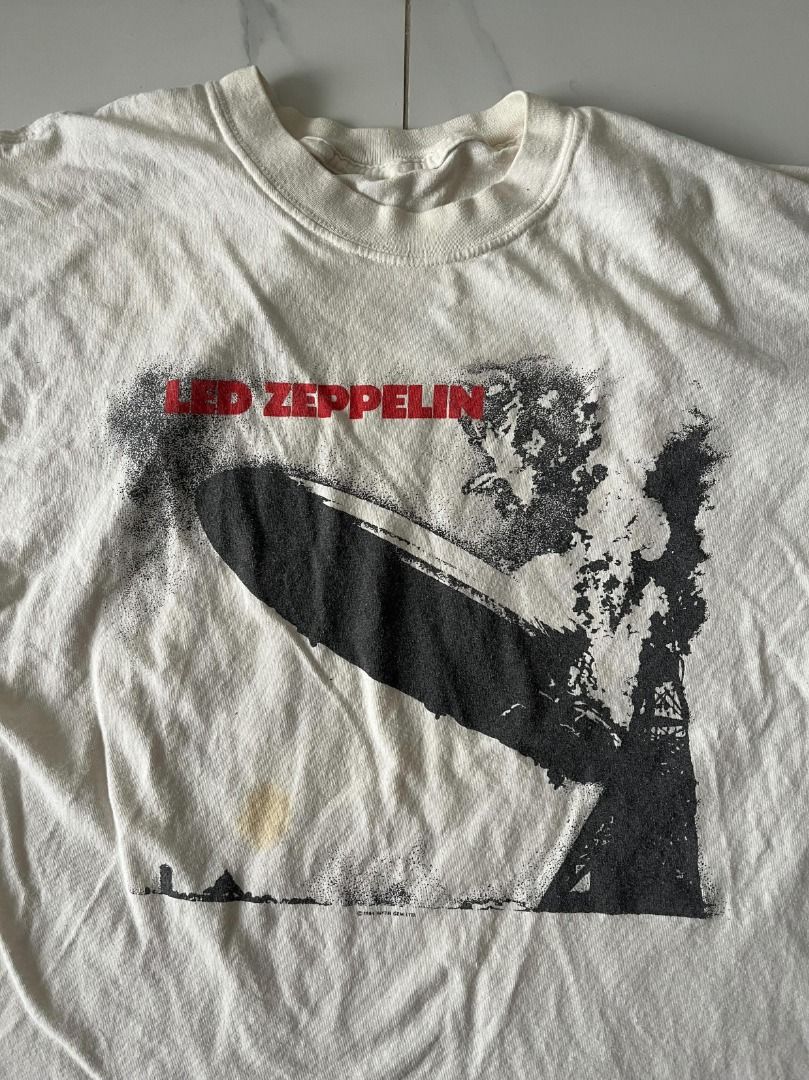 1984 Led Zeppelin Promo by Myth Gem Ltd. (Category: Tshirts & Polo Shirts ) located in Manila. Submitted by thrift.psd (Listing ID 1445170486, Image 1). Description: 1984 Led Zeppelin Promo by Myth Gem Ltd. Cut tag Some distressing (repaired slice, yellow stain, small slice) No size on tag Length: 28in Width: 22in.
