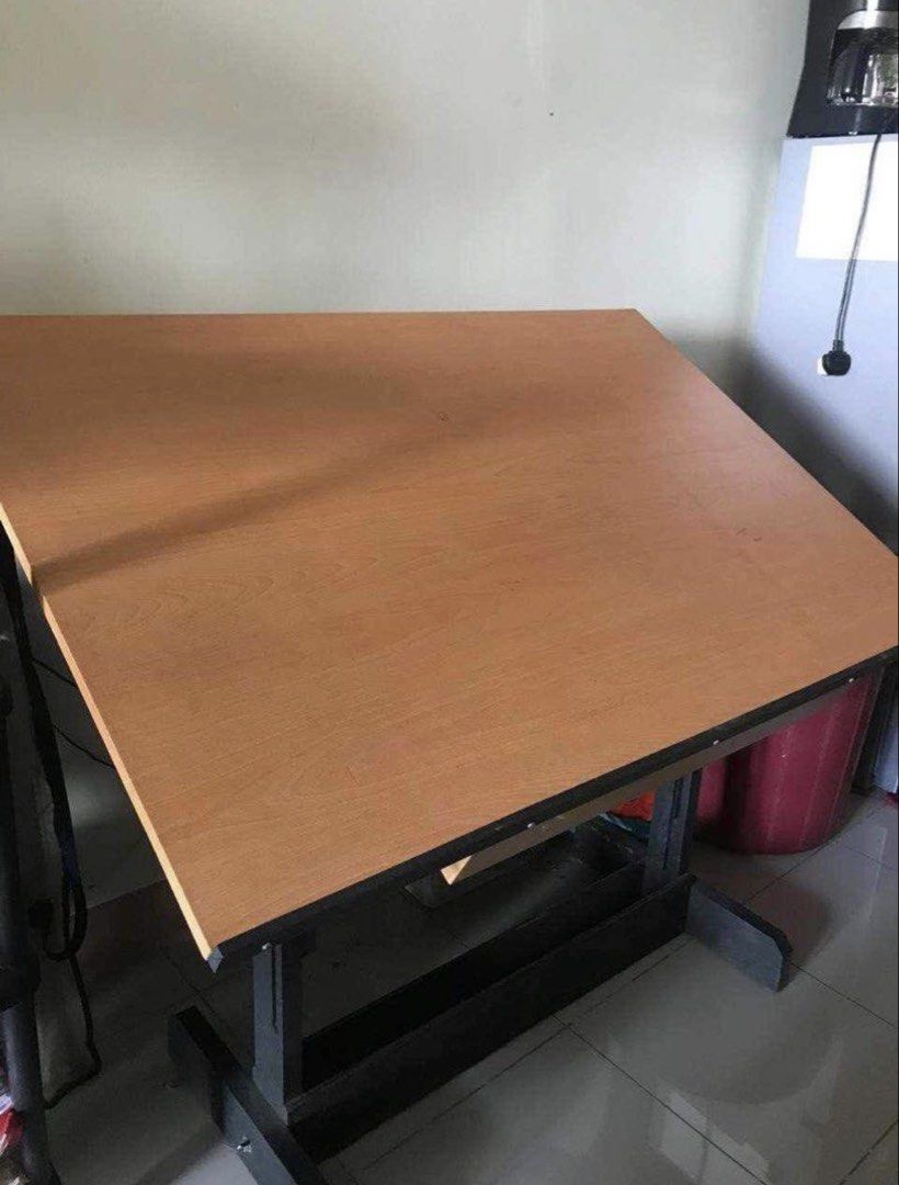 47.5” x 36” Adjustable Drafting Table with Drawer and Accessories (Category: Tables & Sets) located in San Juan City. Submitted by mofusand_ (Listing ID 1445044622, Image 1). Description: - Adjustable wooden drafting table - Built-in drawer for storage - Ideal for art and design projects - Ready for a new home!.