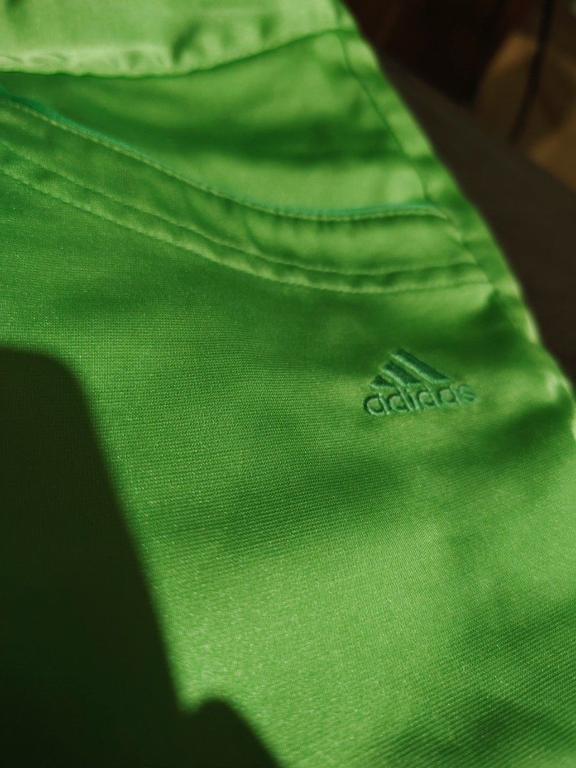 Adidas Green Athletic Shorts S/P (Category: Shorts) located in Luisiana. Submitted by sahayamay77 (Listing ID 1445110803, Image 1). Description: - Bright green Adidas shorts - Shiny material, great for sports or casual wear - Embroidered Adidas logo on the side - Size S/P - Front and back pockets - Feel free to ask any questions!.