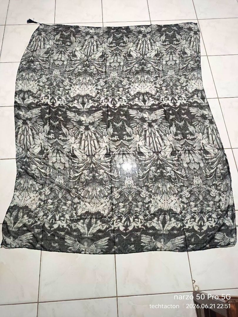Angel and Demons Scarf random brand (Category: Scarves) located in Santo Tomas. Submitted by pickers_corner (Listing ID 1445201870, Image 2). Description: - Lightweight scarf with a detailed black and white graphic print. - Features a repeating pattern of skeletal figures and angelic beings. - Measures approximately [insert length] by [insert width]. - Can be styled in many ways. - Adds a unique touch to any outfit..