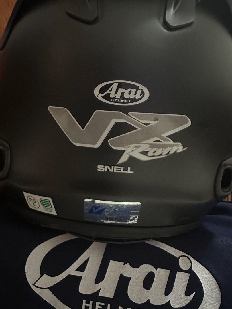 Arai VZ-RAM Flat Black Motorcycle Helmet (Size 59-60) (Category: Motorcycle Apparel) located in Singapore. Submitted by Guinnessz (Listing ID 1445169991, Image 2). Description: - Arai VZ-RAM Helmet - Color: Flat Black - Size: JP (59-60) - Certification: Snell - Visor: Clear - Accessories: Helmet bag included Wear for a week n find helmet didn’t suit me . Last photo show a slight scalp. But helmet no drop before..