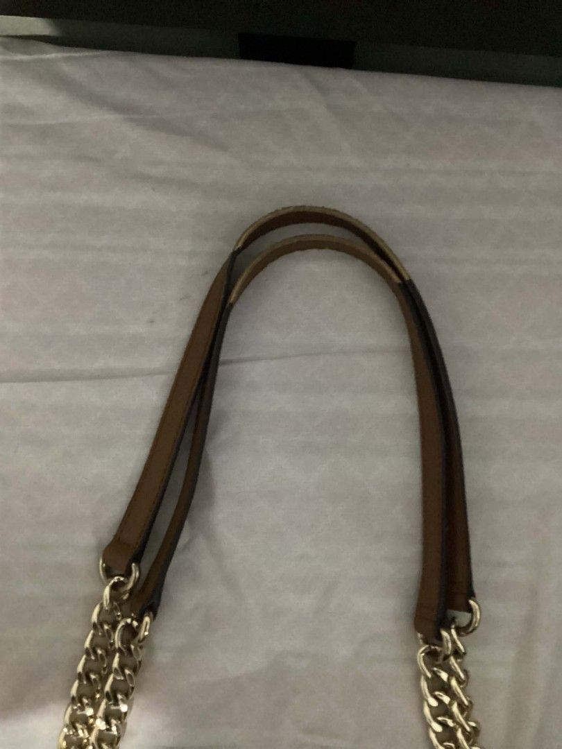 Authentic Calvin Klein Bag (Category: Luxury Bags & Wallets) located in Batangas. Submitted by snpfinds. (Listing ID 1445064344, Image 2). Description: - Authentic Brown Calvin Klein Shoulder Bag - LAST PRICE!!!!!! - All-over CK Monogram Print - Gold Chain and Leather Shoulder Straps - Classic Tote Shape - Ideal for Everyday Use - Spacious Interior for All Your Essentials - Clean and Timeless Design.
